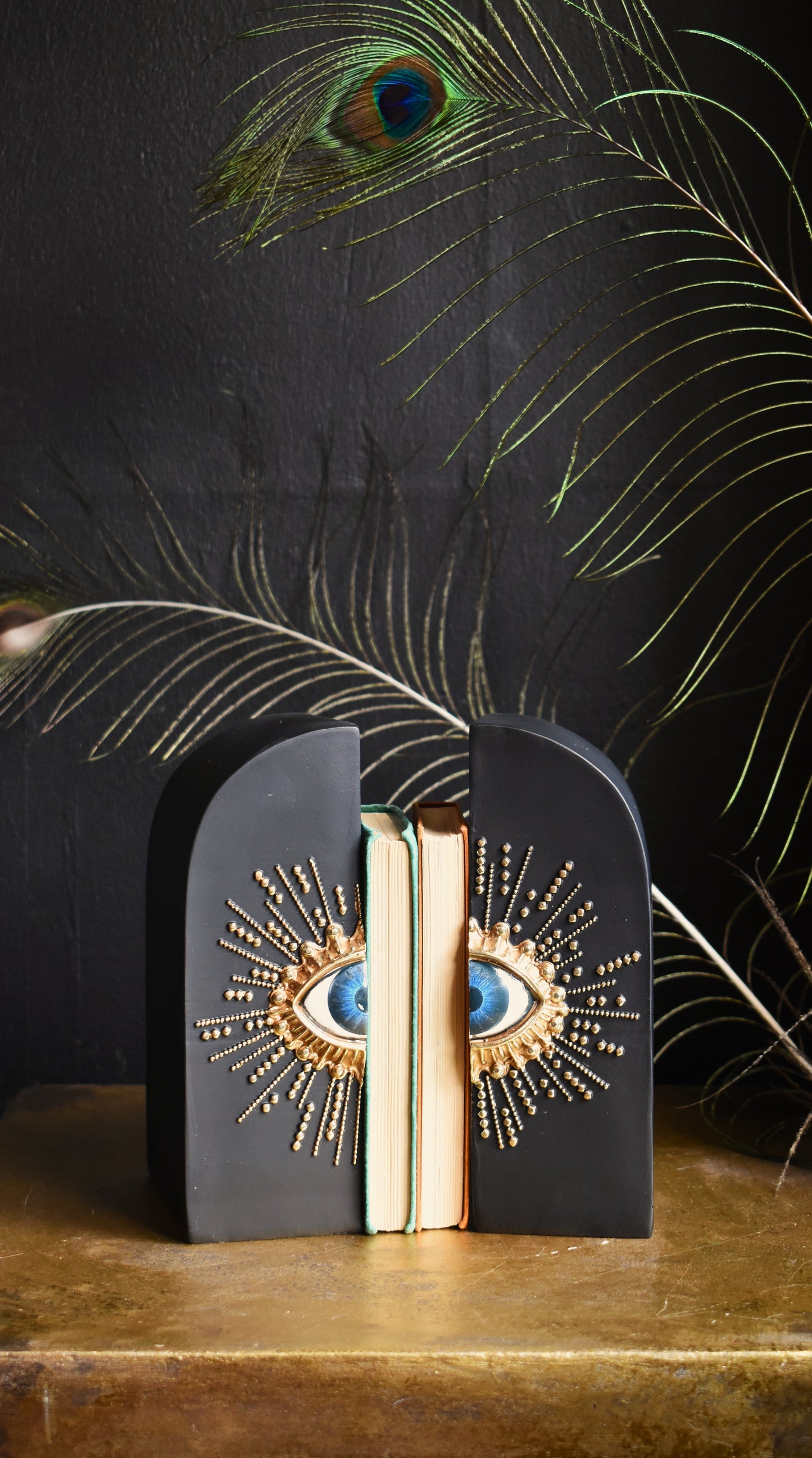 Pair Of Embossed Sunburst Eye Bookends
