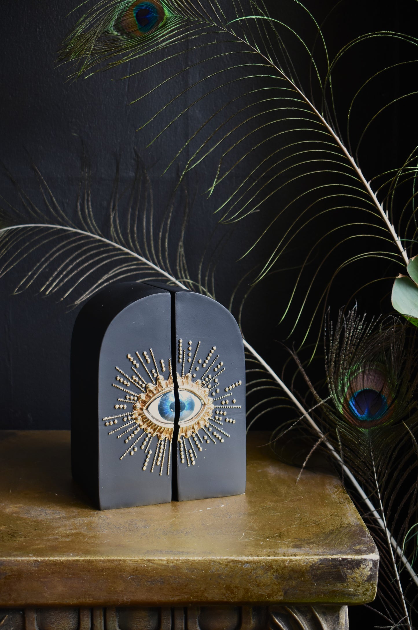 Pair Of Embossed Sunburst Eye Bookends