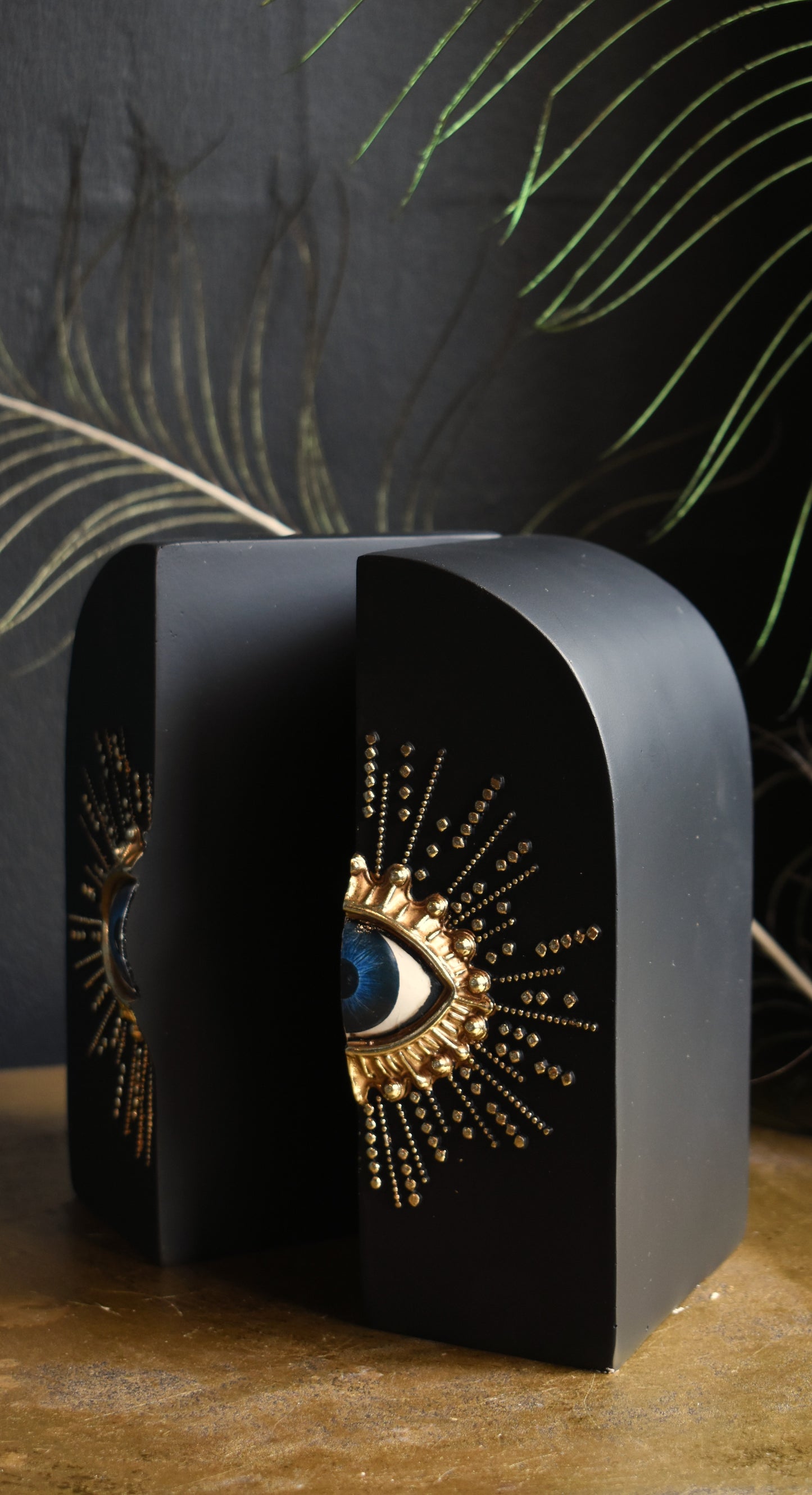 Pair Of Embossed Sunburst Eye Bookends