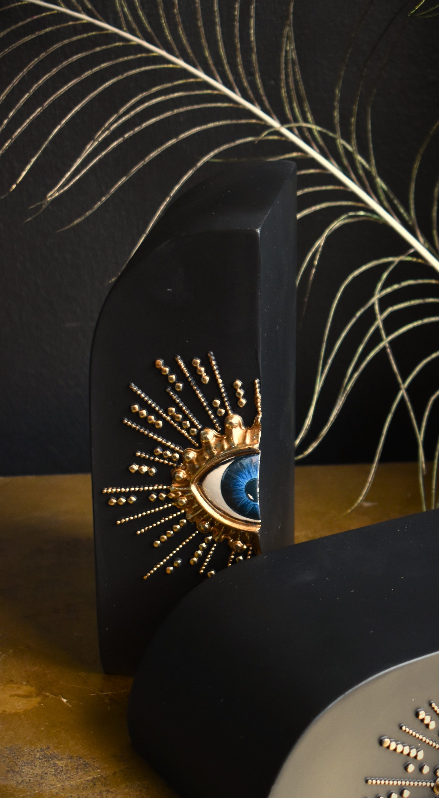 Pair Of Embossed Sunburst Eye Bookends